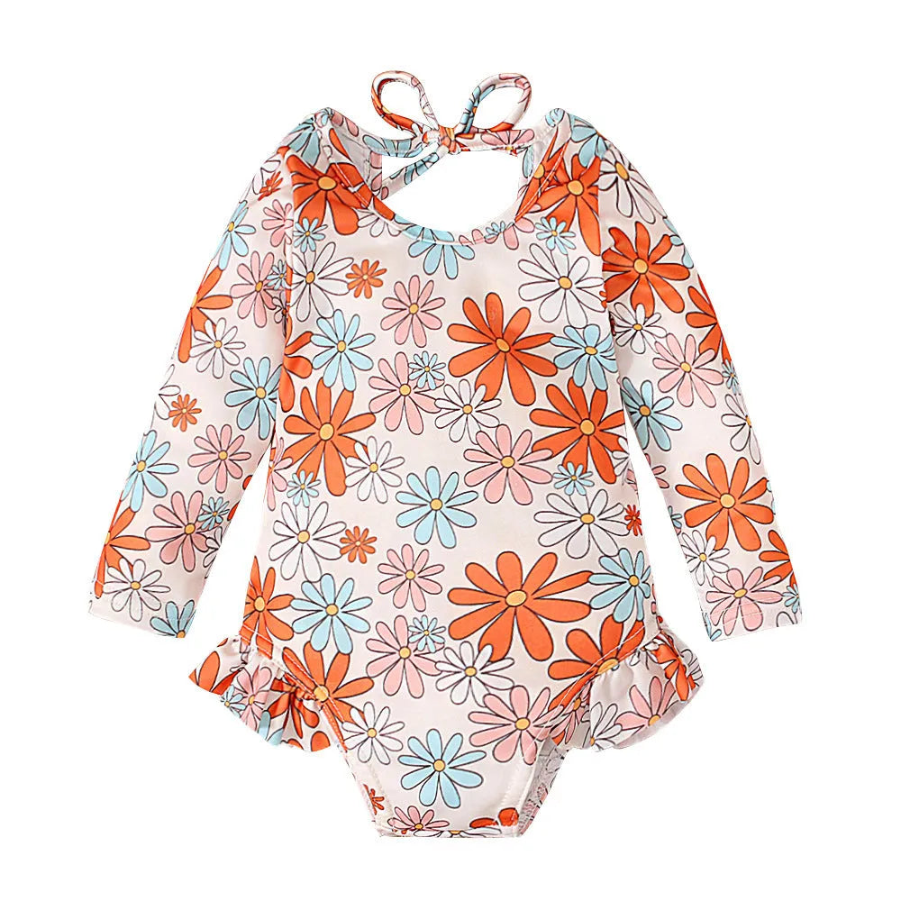 Girl's floral print swimsuit with crew neck and open back design in polyester fabric