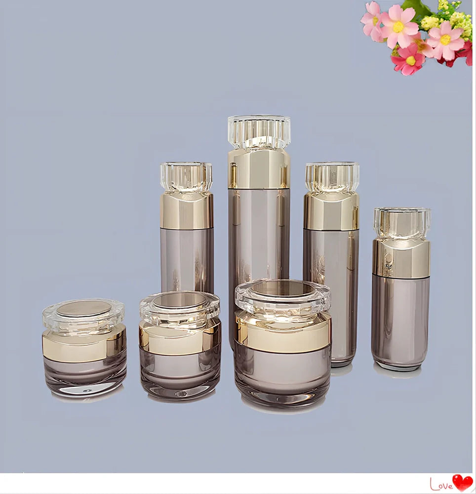 Acrylic cosmetics bottles in champagne gold and brushed white with vacuum sealing, various sizes from 5g to 120ml