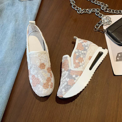 Women's lace mesh high heel sneakers in green and pink with slope heel design