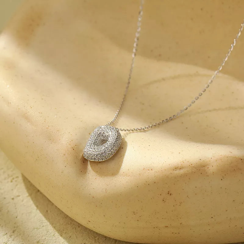 Stainless steel initial pendant necklace with zircon accents, personalized with your choice of letter.