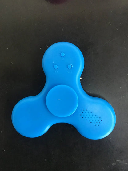 White Bluetooth speaker fidget spinner EDC toy with MP3 player functionality showing compact design