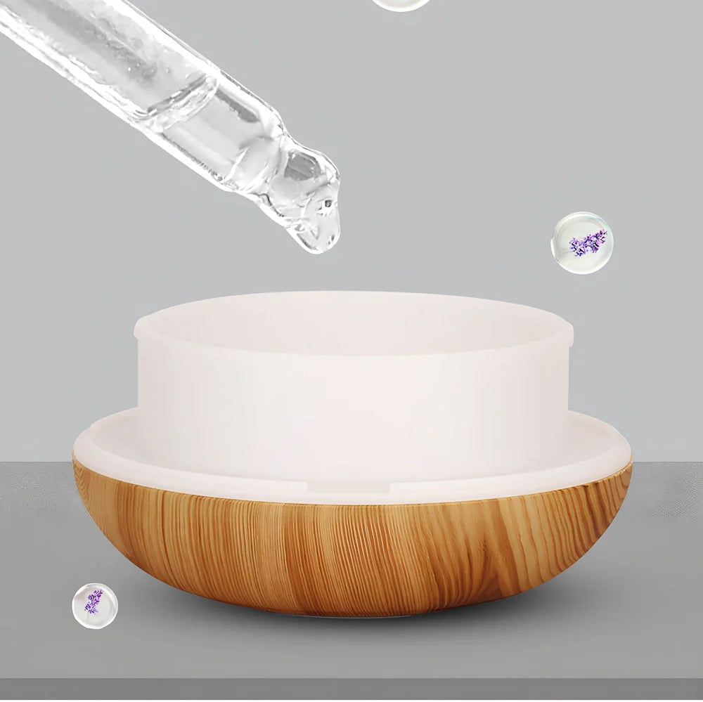 Round wood grain humidifier with USB cable and single mist outlet on light oak finish