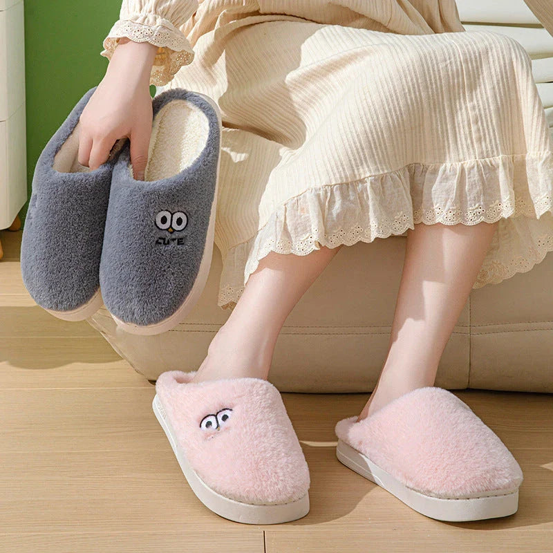 Cozy cartoon slippers with big eyes, available in various colors and sizes for couples to enjoy at home