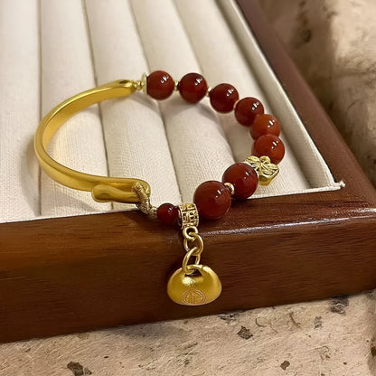 Golden antique-style Southern Red Agate Character Ingot half bracelet for women with lucky bag design.