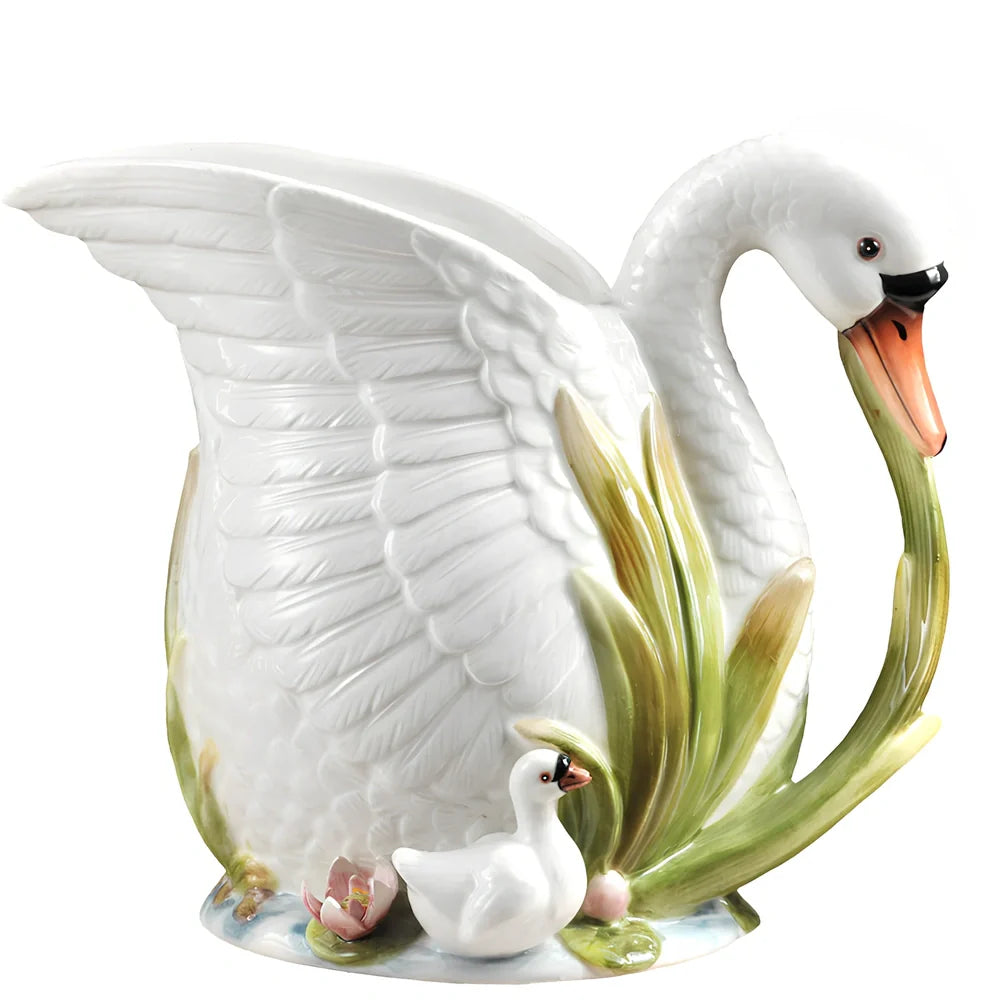 Ceramic vase with embossed swan design measuring 24.1cm length 15.2cm width 20cm height