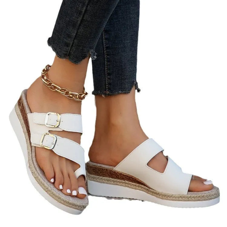 White patent leather wedge sandals with peep toe and finger fit design