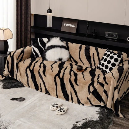 Zebra pattern sofa cover cloth in flannel fabric with non-slip backing, shown in caramel colour on a sofa
