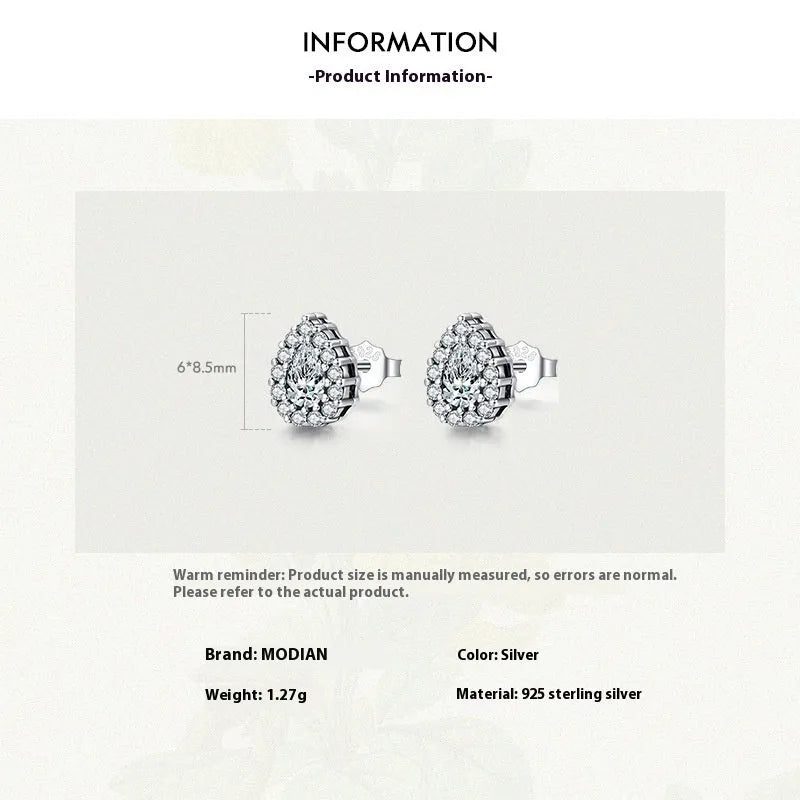 A pair of women's silver drop-shaped ear studs with a polished finish on a white background.