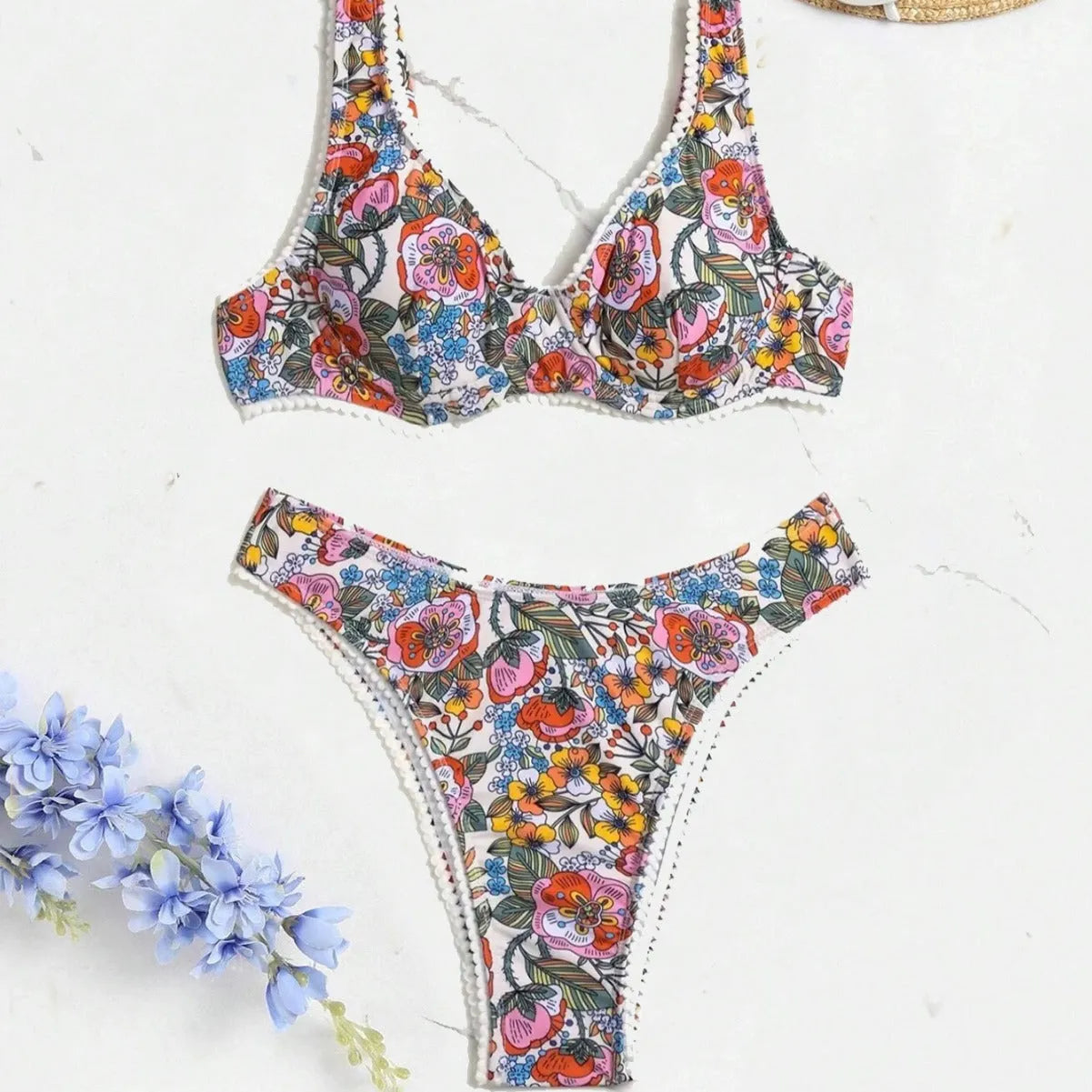 Women's floral print bikini with high waist briefs and adjustable ties.