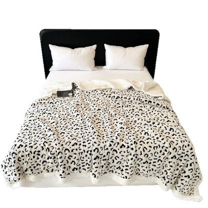 Double-layer cationic leopard jacquard taffeta blanket showing raised animal print pattern in available colour options
