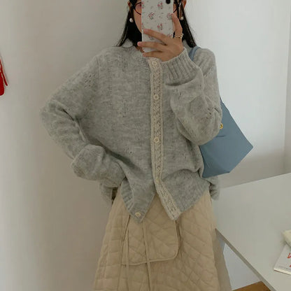 Loose-fitting artistic retro sweater coat in viscose fibre, shown in apricot colour.