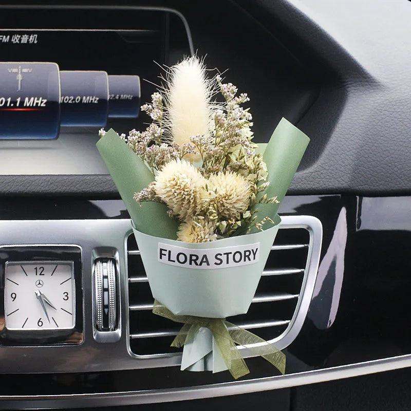 Mini dried flower bouquet mounted in car air vent for decorative aromatherapy