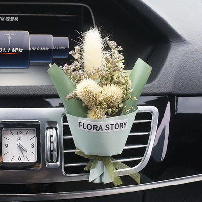 Mini dried flower bouquet mounted in car air vent for decorative aromatherapy