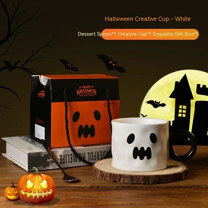 Ceramic pumpkin-shaped mugs in orange and white colors, featuring a sturdy handle and festive holiday design