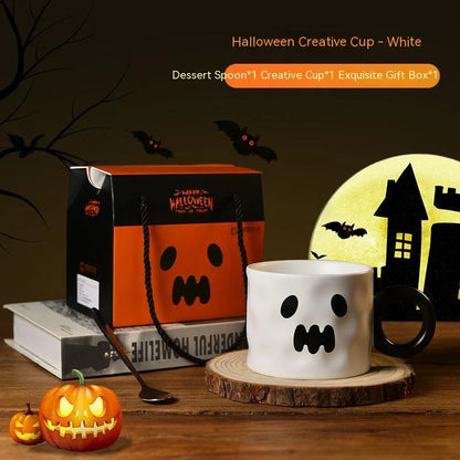 Ceramic pumpkin-shaped mugs in orange and white colors, featuring a sturdy handle and festive holiday design