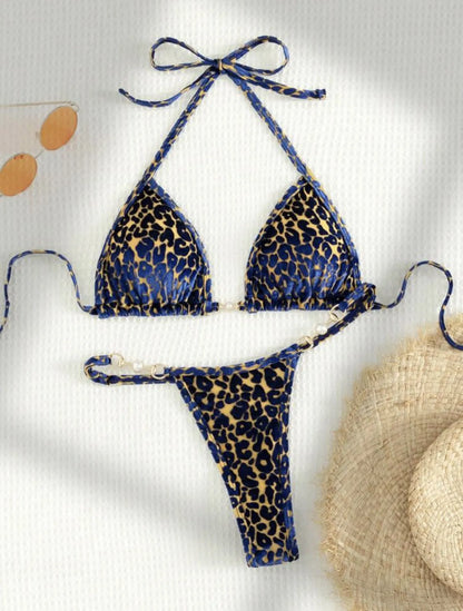 Women's blue leopard print T-shaped bikini set for swimming on a mannequin.