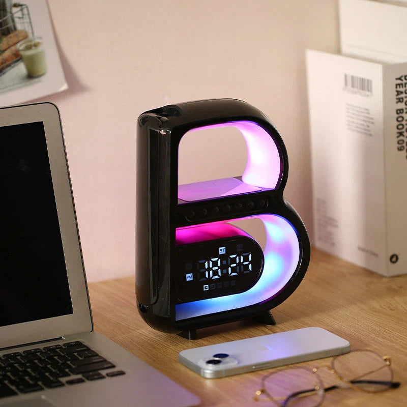 B-shaped Bluetooth speaker with wireless charging, adjustable lighting, and alarm clock functionality