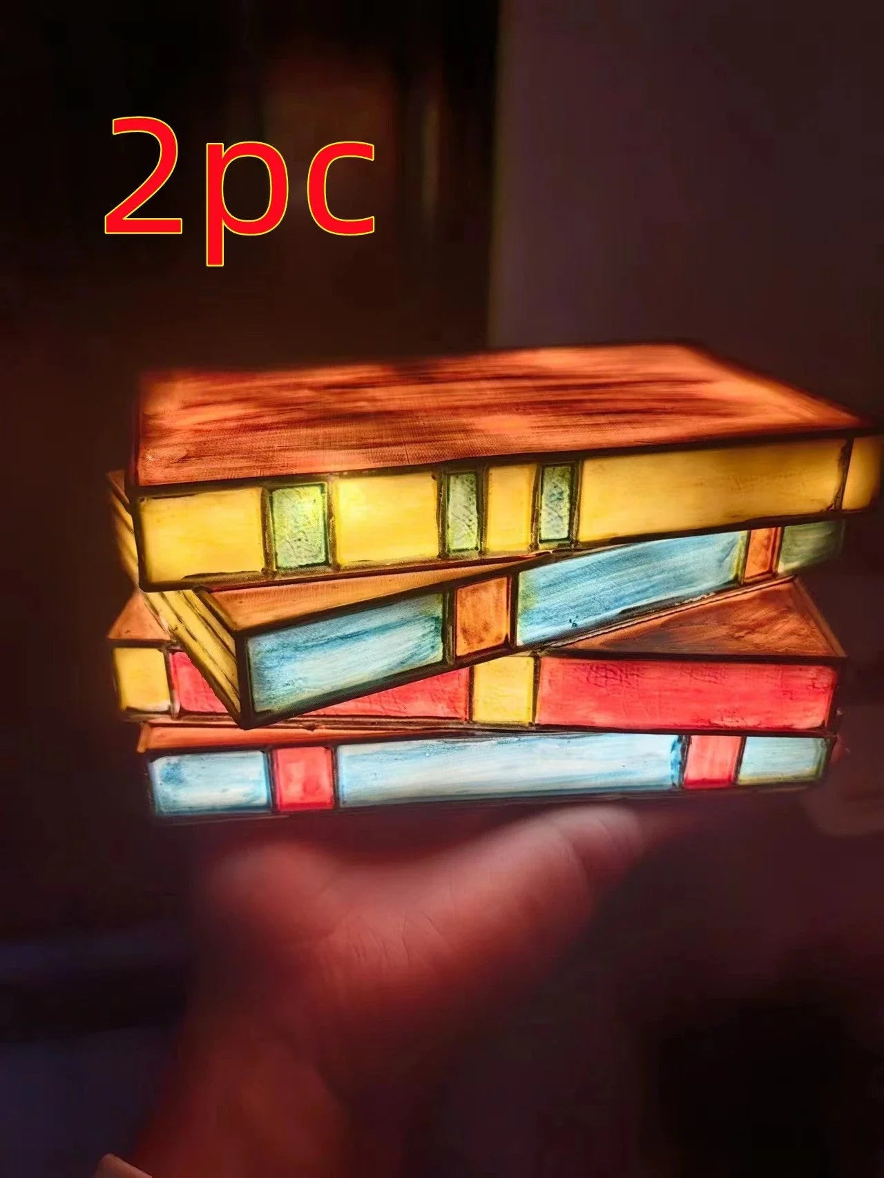 Elegant vintage-inspired table lamp with stacked book design and handcrafted glass panels, creating a warm, ambient lighting solution for reading nooks and living spaces.