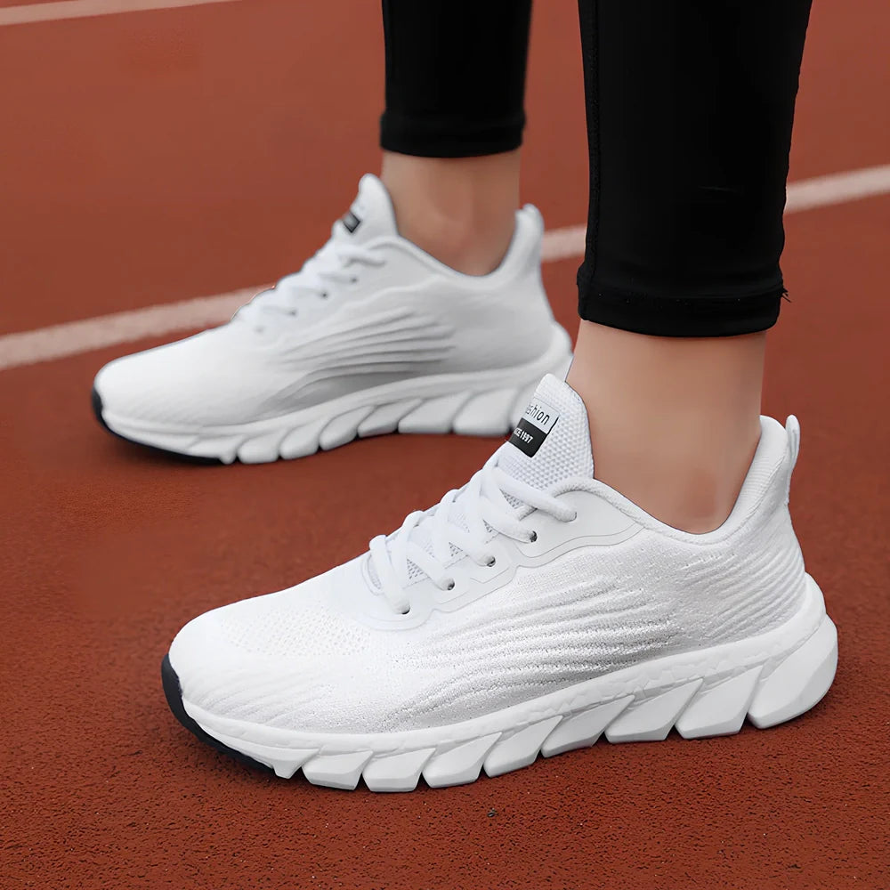 Women's black running sneakers with MD soles and cross strap detailing for jogging