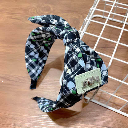 Geometric fringed headband in cloth material with manual craftsmanship details