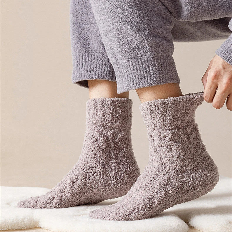Cozy coral fleece socks in various colors, designed for superior comfort and warmth
