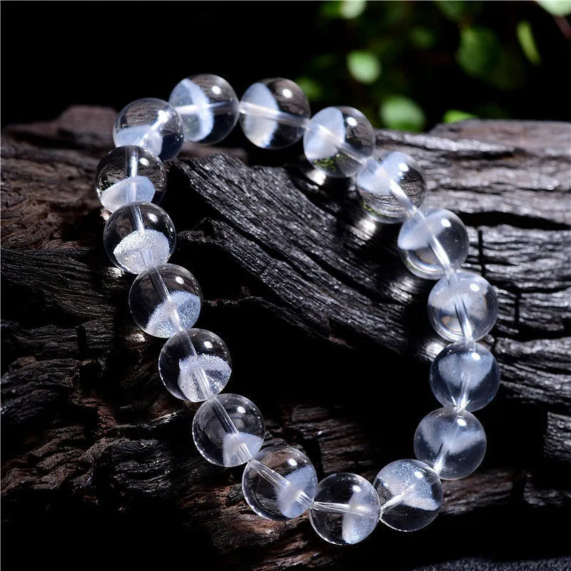 Women's original design bracelet with white crystal ghost pyramid beads and a ruyi decorative element.