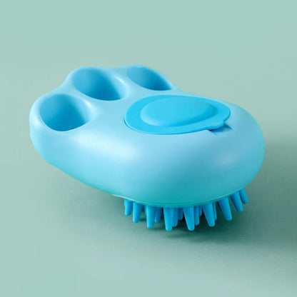 Claw-shaped pet grooming brush in pink, blue, yellow, and grey