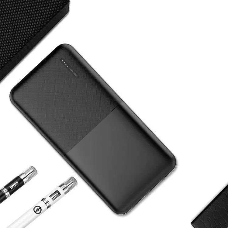 Black and white 20000 mAh power bank with heating function showing multi-USB ports