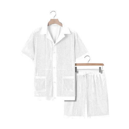 Women's lake blue see-through short sleeve cardigan and matching shorts beach cover-up set laid flat.