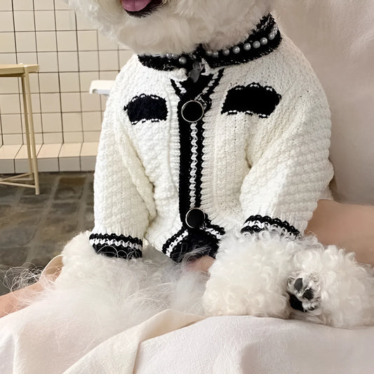 White Korean-style puppy sweater with a pearl collar on a small dog, showing the princess style design.