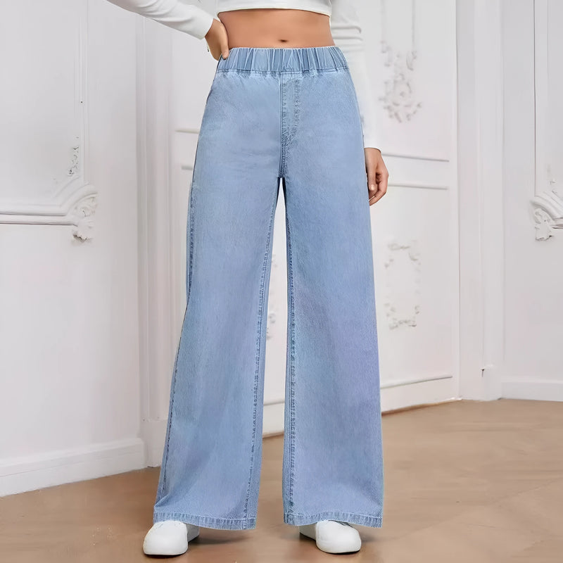 Wide-leg plus size light blue washed straight denim trousers with zip placket and mid waist, available in sizes S to XXXL for youth wear, made from 100% polyester fibre with no elasticity for a structured fit.