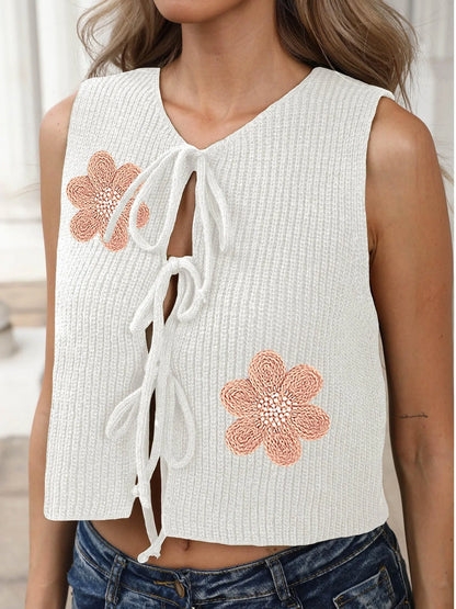 White deer plush polyester vest cardigan with lace-up front, bow, and apricot flower embroidery on chest.