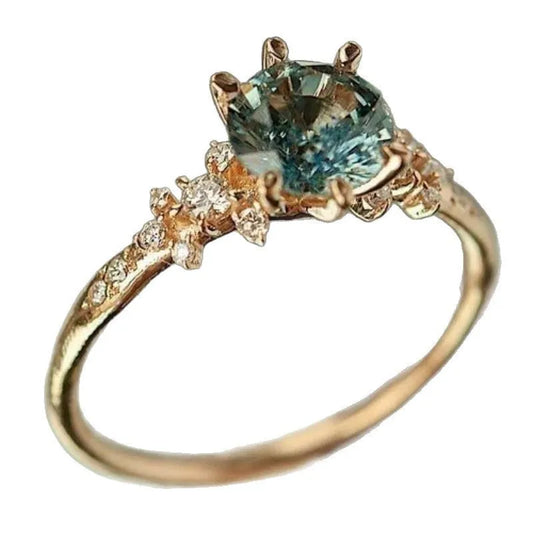 Geometric gold plated ring with chamfered square pattern and inlaid zircon stones in claw settings