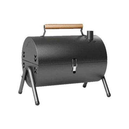 White round portable grill with chimney oven, carbon tanks, and grilled meshes for frying and baking outdoors.