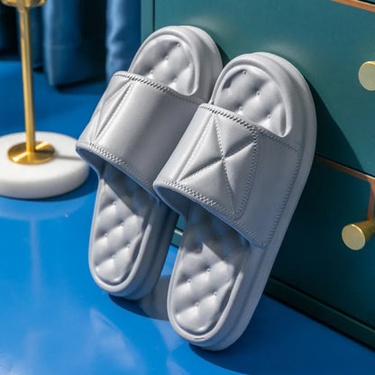 A pair of thick-soled EVA bathroom slippers in a selected colour, showing their injection-moulded non-slip design.