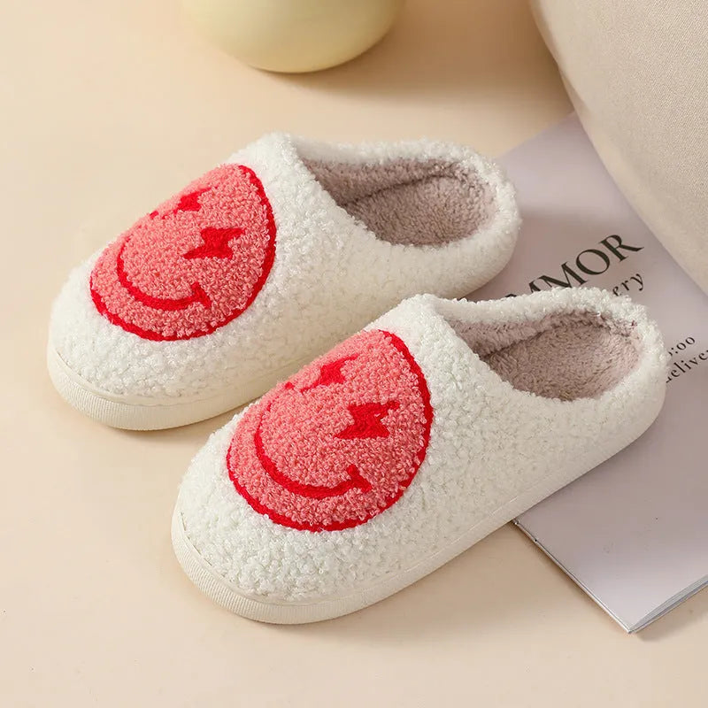 Women's plush home slippers in cartoon designs with a non-slip PVC sole.