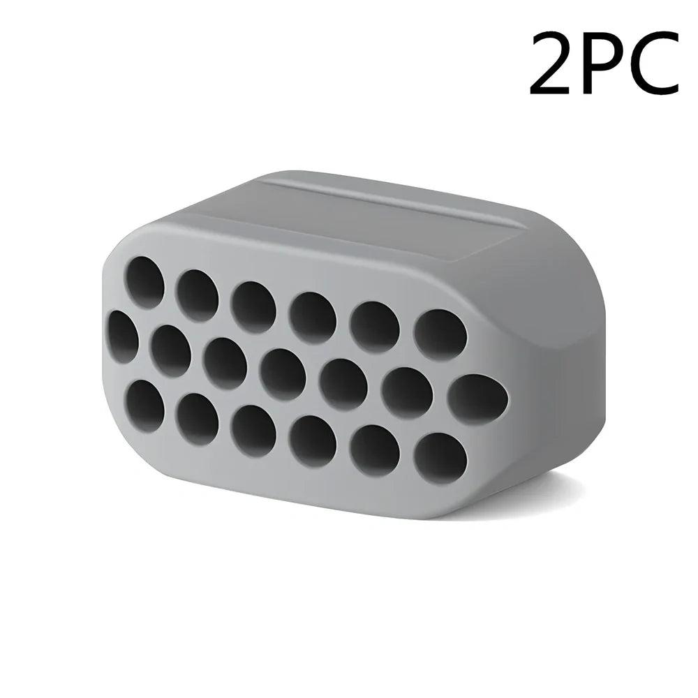 Compact black silicone jaw trainer for muscle shaping, food-grade material, portable at 5cm size for daily facial exercises