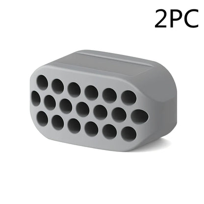 Compact black silicone jaw trainer for muscle shaping, food-grade material, portable at 5cm size for daily facial exercises