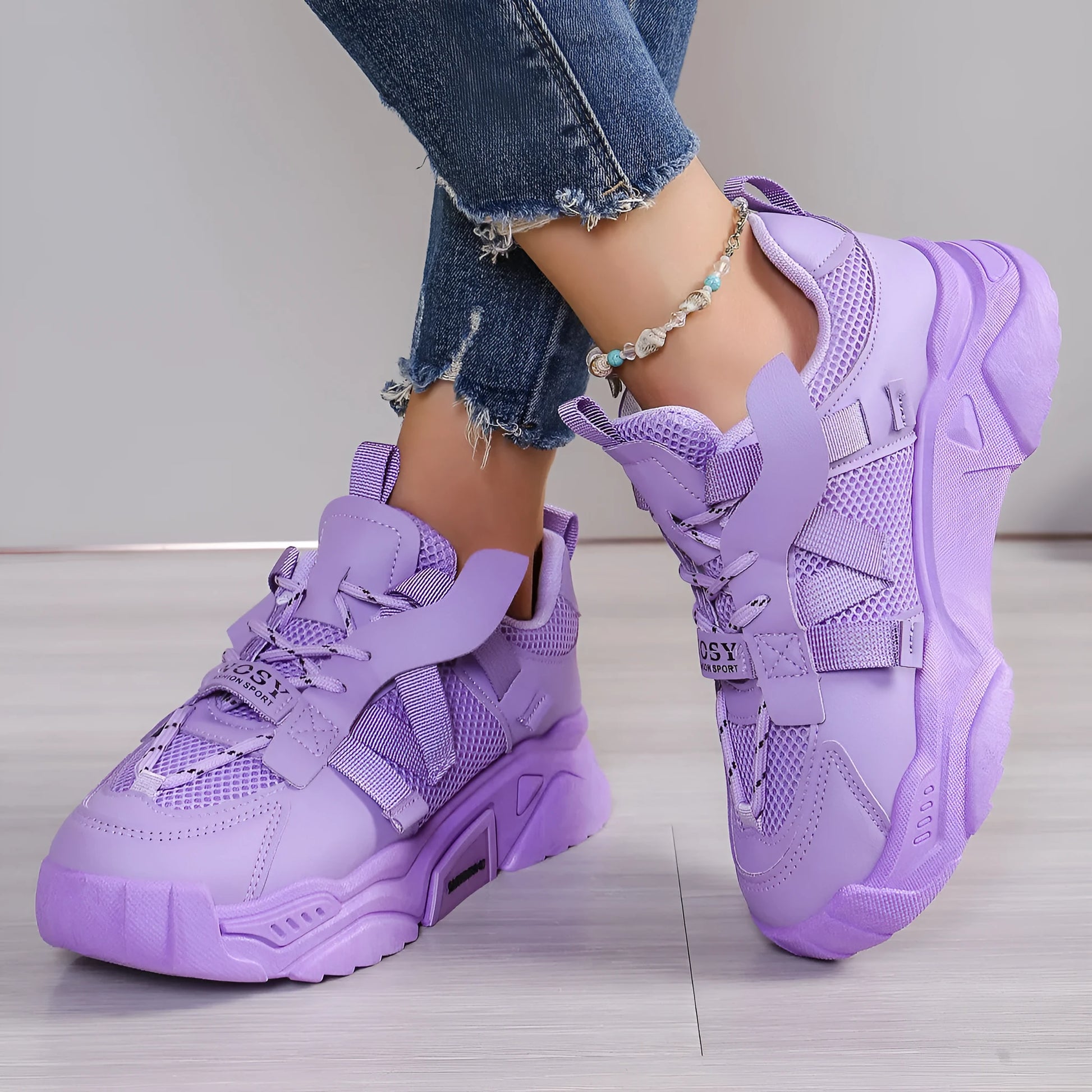 Women's platform sneakers in animal print with breathable mesh upper and front lace-up design.