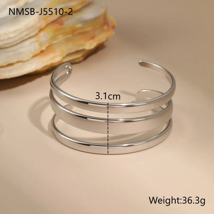 Women's stainless steel bracelet with geometric line design and simple opening clasp in gold electroplated finish