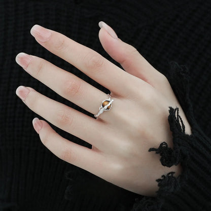 Silver saturn open ring with adjustable opening in white gold colour finish featuring tigereye design elements