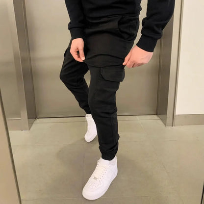 Men's loose-fit casual trousers with elastic waistband and patch pockets in army green colour