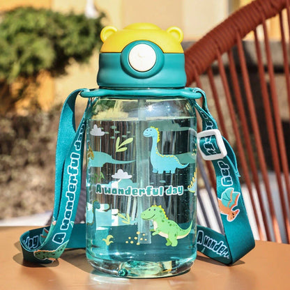 Red children's water cup with shoulder strap showing cartoon pattern and suction nozzle