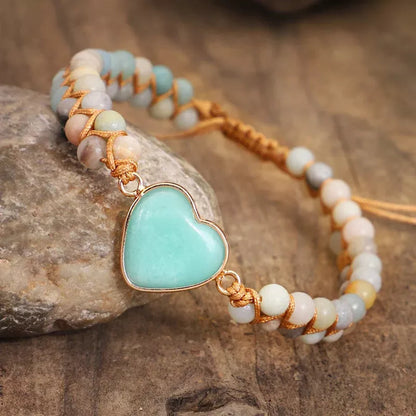 Adjustable heart charm bracelet with blue-green amazonite stones and braided macrame wristband