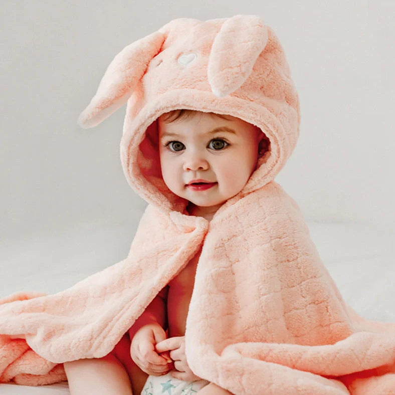 Coral fleece bath towel measuring 125cm by 80cm, featuring a 40-count yarn specification for enhanced softness and absorbency, available in lion, rabbit, shark, unicorn, and koala baby designs
