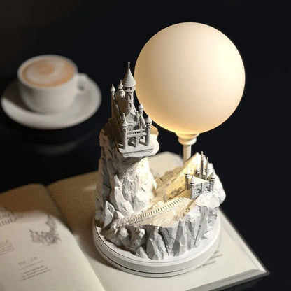 White composite gypsum desk lamp with a wire control switch on a table.