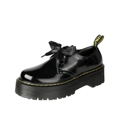 Women's black and white thick-soled leather shoes with cross-strap design and TPR tendon soles
