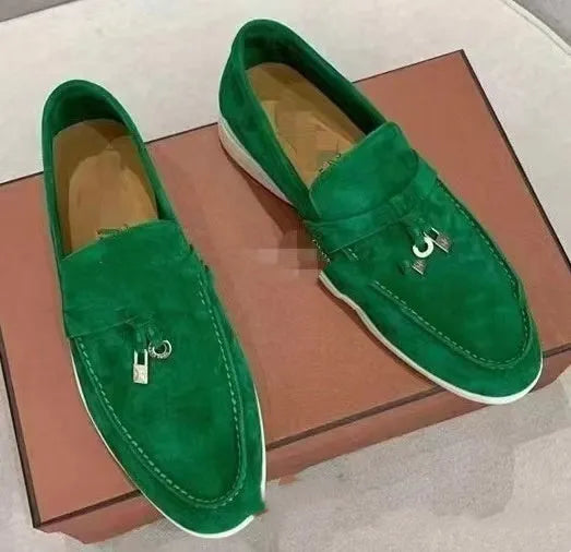 High top slip-on loafers in black with round toe and sewing line detail on a rubber sole.
