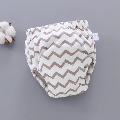 Washable baby training pants with 6-layer gauze construction in assorted patterns including animals and geometric designs