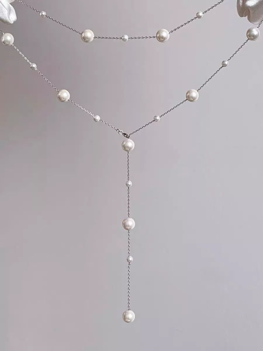 Starry Pearl Choker Necklace in gold and silver options, featuring imitation pearls and electroplated finish.